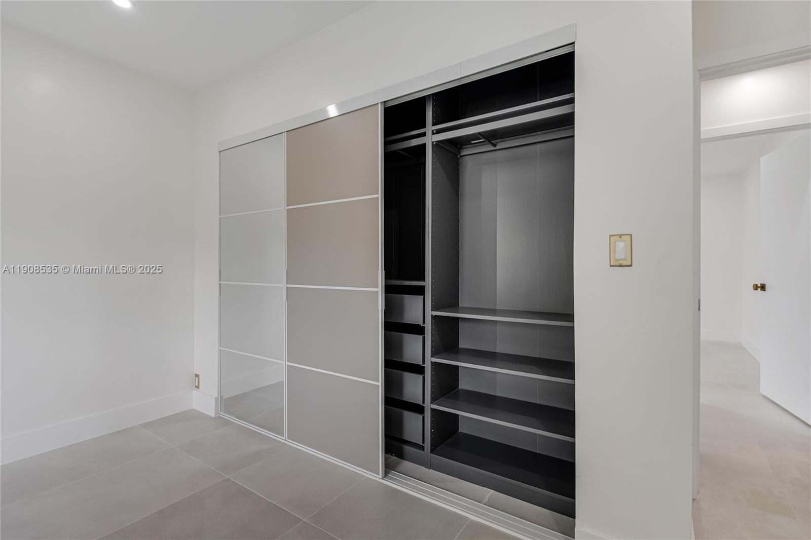 1244 Southwest 14th Street Miami, FL 33145 - Photo 51 of 63 a view of walk in closet with empty racks
