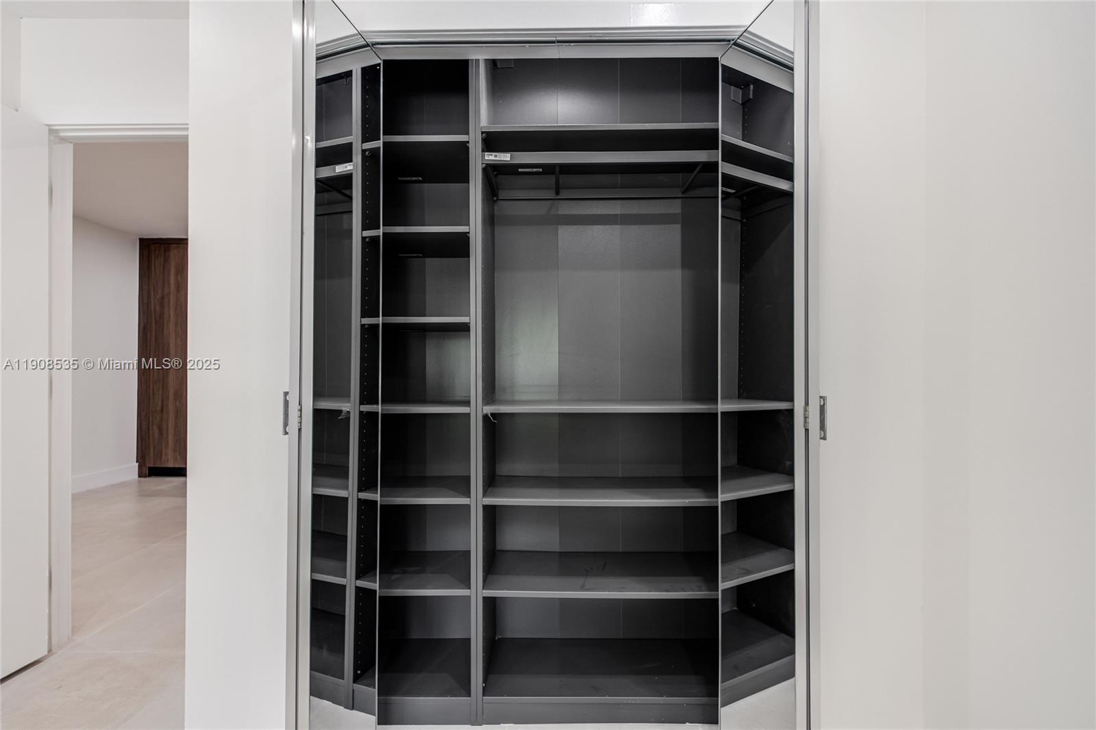 1244 Southwest 14th Street Miami, FL 33145 - Photo 54 of 63 a view of walk in closet with empty racks