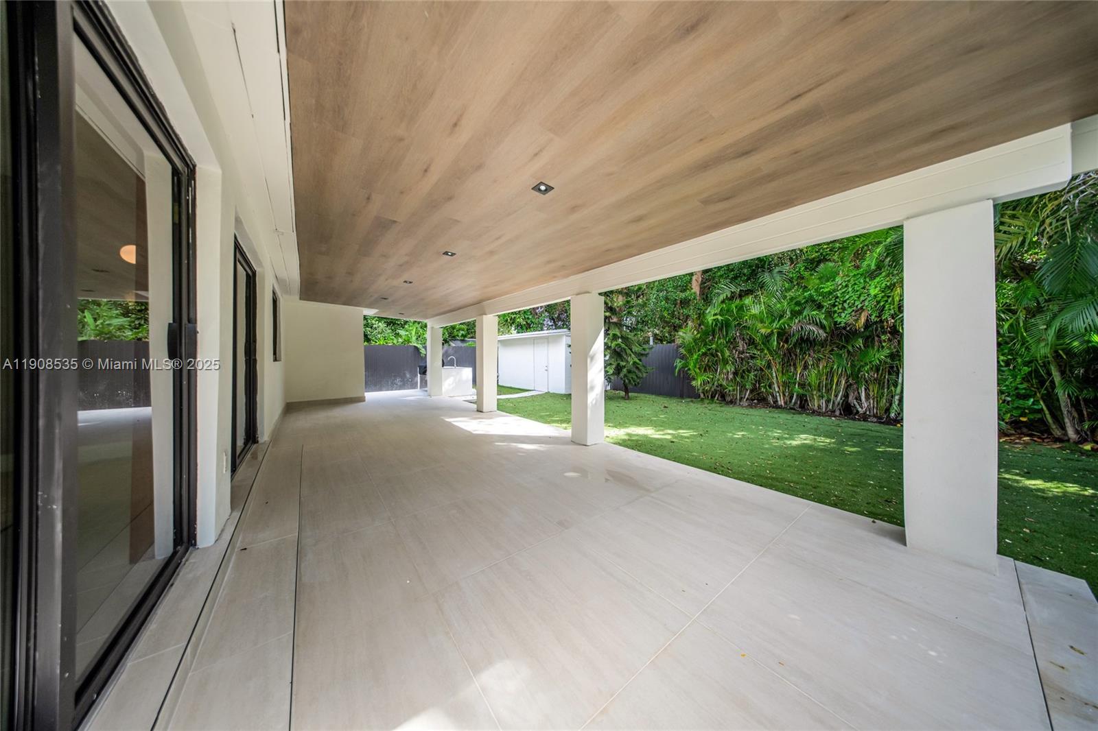 1244 Southwest 14th Street Miami, FL 33145 - Photo 57 of 63 a view of a porch with furniture and garden