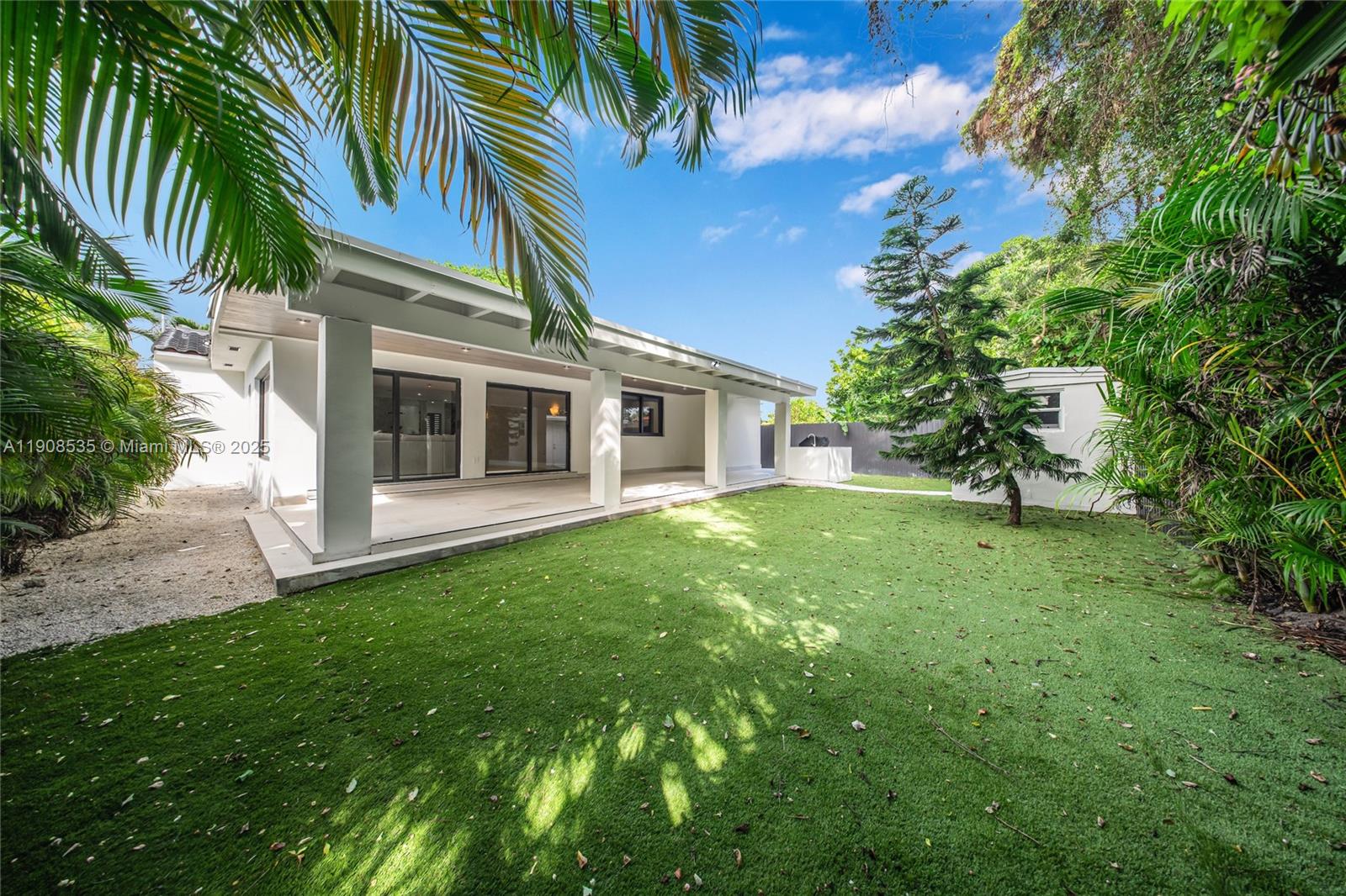 1244 Southwest 14th Street Miami, FL 33145 - Photo 58 of 63 a view of a house with a yard