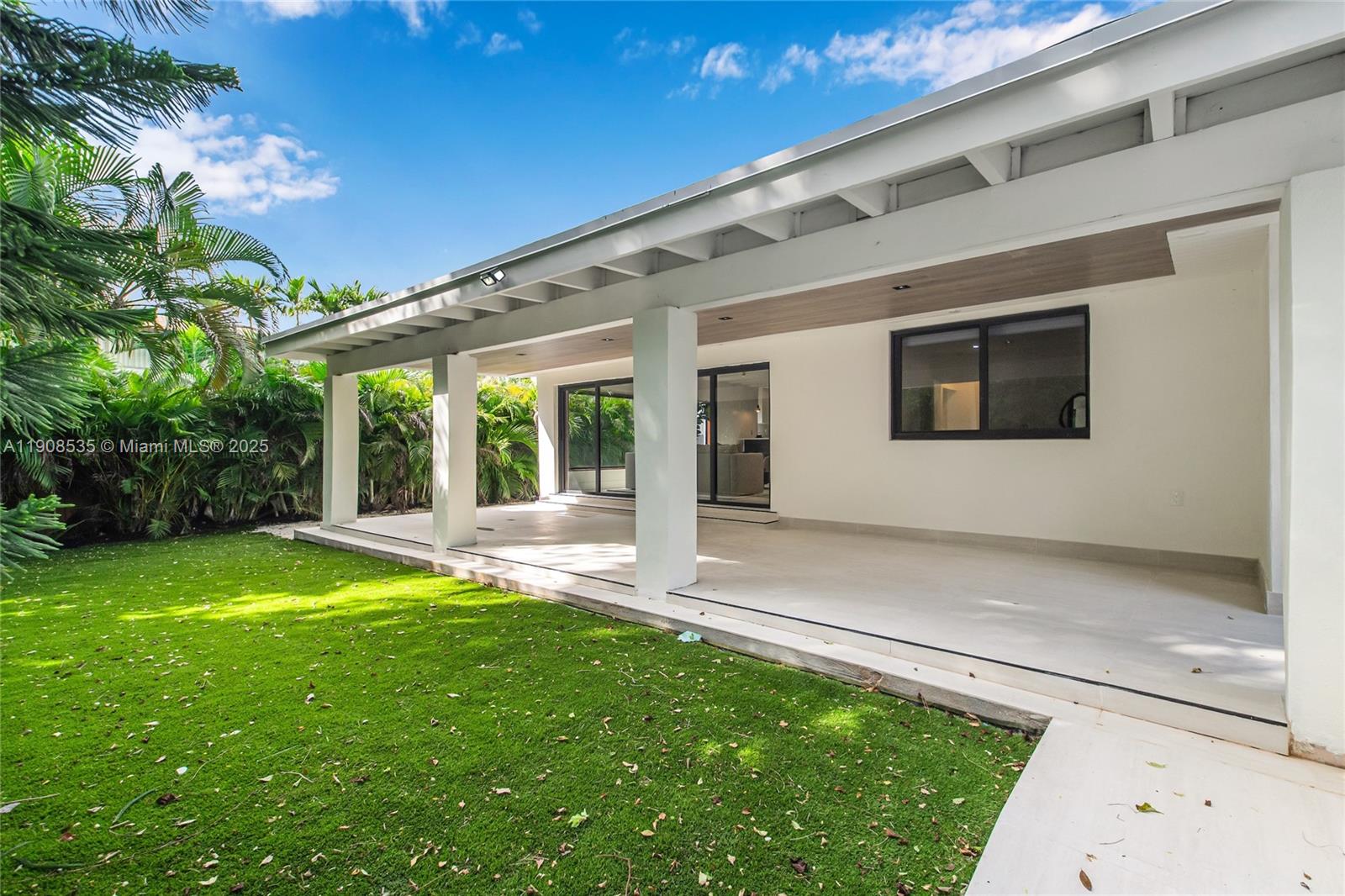 1244 Southwest 14th Street Miami, FL 33145 - Photo 59 of 63 a front view of a house with a yard