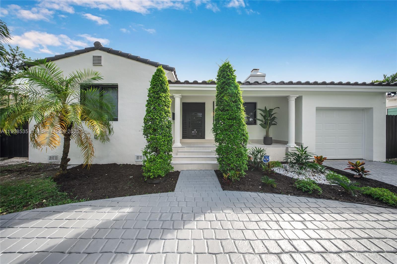 1244 Southwest 14th Street Miami, FL 33145 - Photo 61 of 63 a front view of a house with garden