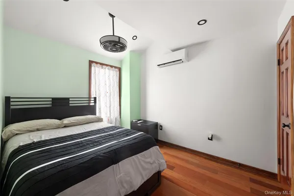 a bedroom with bed and window