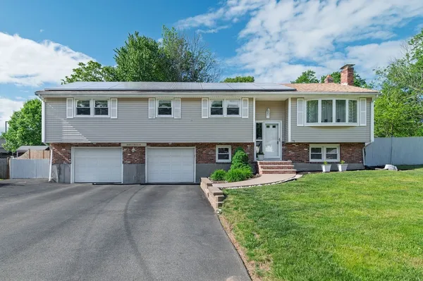 a front view of house with yard and entertaining space