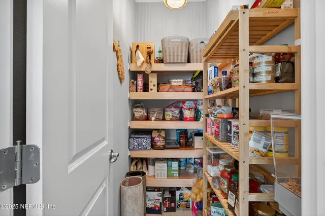a shelf with books and knick knacks on it