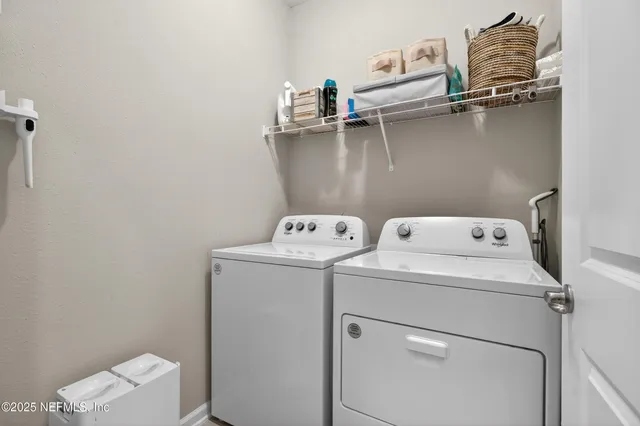 a utility room with dryer and washer