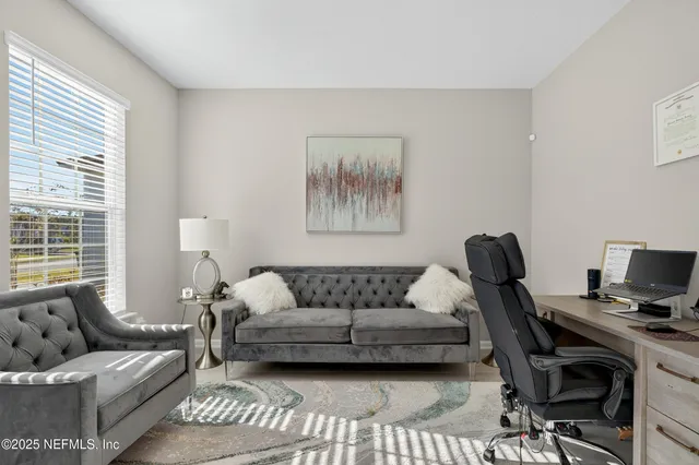 a living room with furniture and a window
