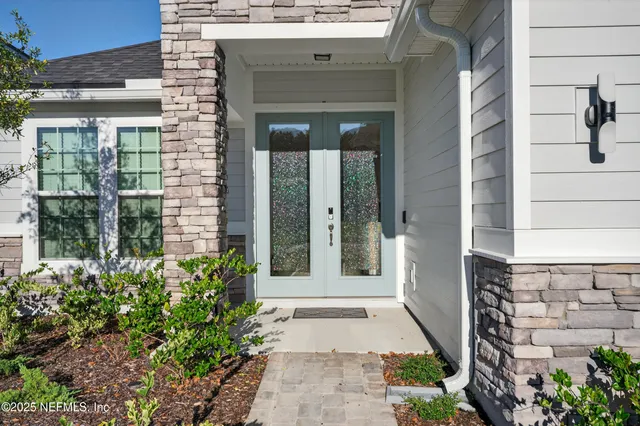 a view of entrance of the house and front of a house