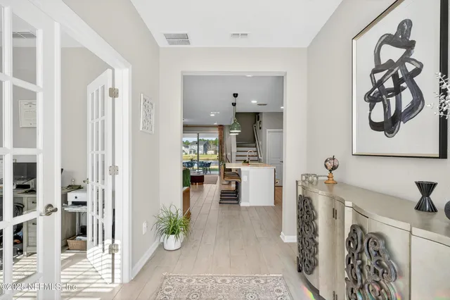 a view of a living room and dining room