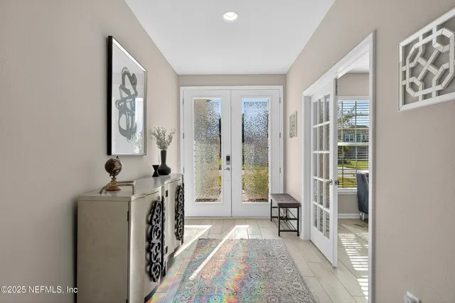 a bedroom with furniture and a window