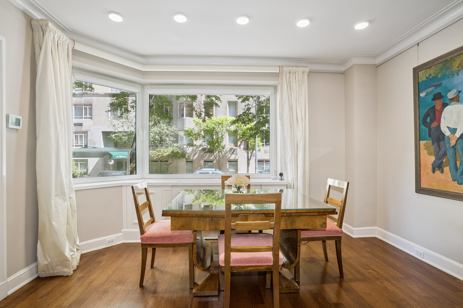 860 5th Avenue, Unit 2E Manhattan, NY 10065 - Photo 2 of 10 a dining room with furniture and wooden floor