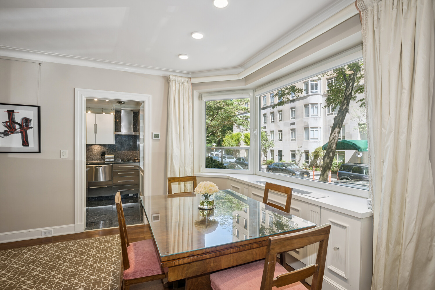 860 5th Avenue, Unit 2E Manhattan, NY 10065 - Photo 3 of 10 a view of a dining room with furniture window and wooden floor