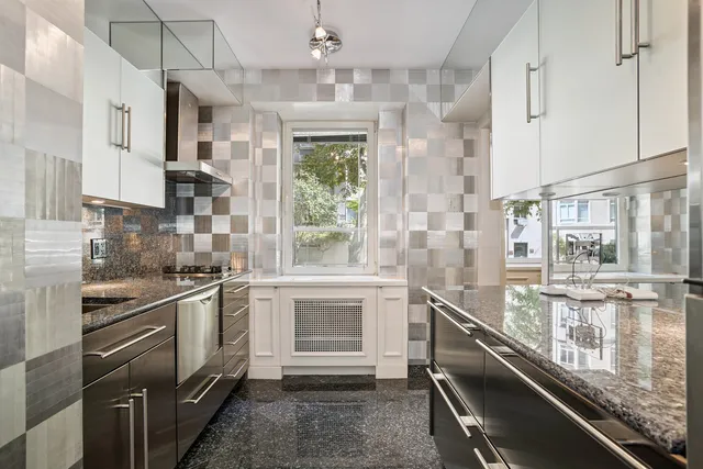 a kitchen with stainless steel appliances granite countertop a stove and a sink