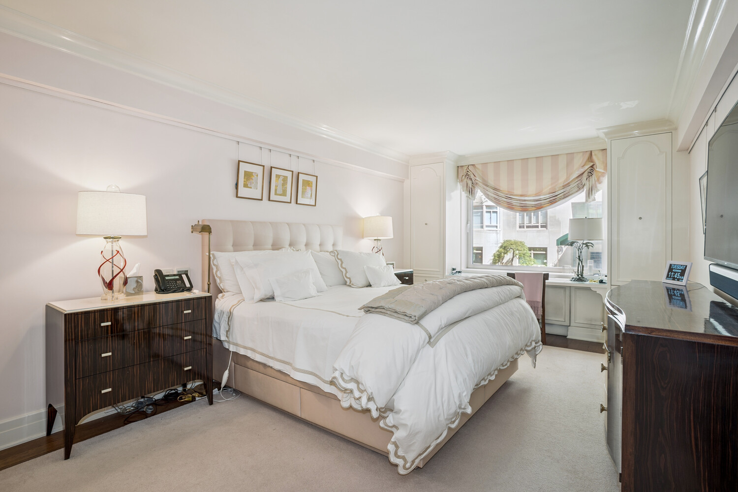 860 5th Avenue, Unit 2E Manhattan, NY 10065 - Photo 6 of 10 a large bedroom with a bed and window