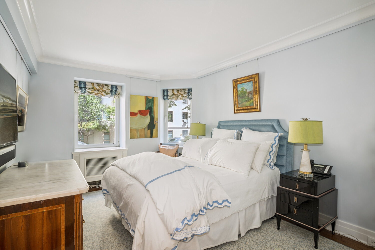 860 5th Avenue, Unit 2E Manhattan, NY 10065 - Photo 8 of 10 a bedroom with a bed and a flat screen tv