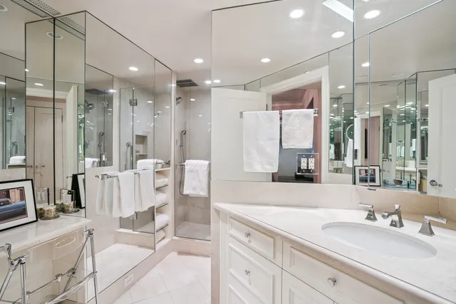 a bathroom with a double vanity sink mirror and double