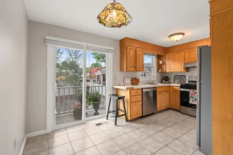 a view of kitchen with windows and furniture