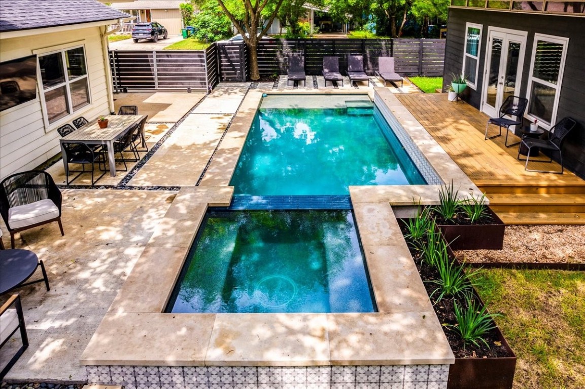 a view of swimming pool with chairs