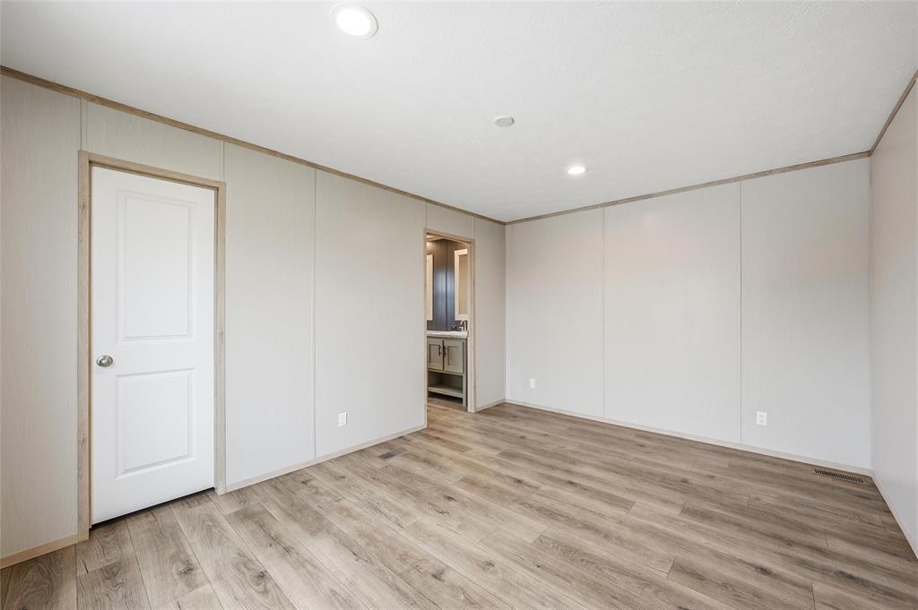 224 Derek Road Eddy, TX 76524 - Photo 11 of 24 a view of empty room with wooden floor