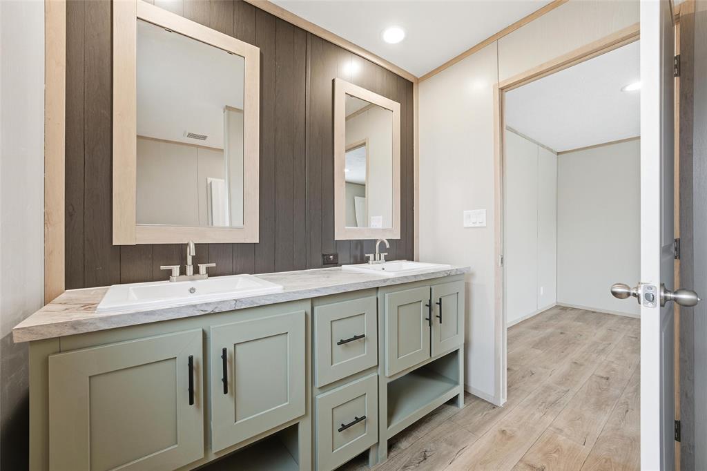 224 Derek Road Eddy, TX 76524 - Photo 13 of 24 a bathroom with a double vanity sink and mirror