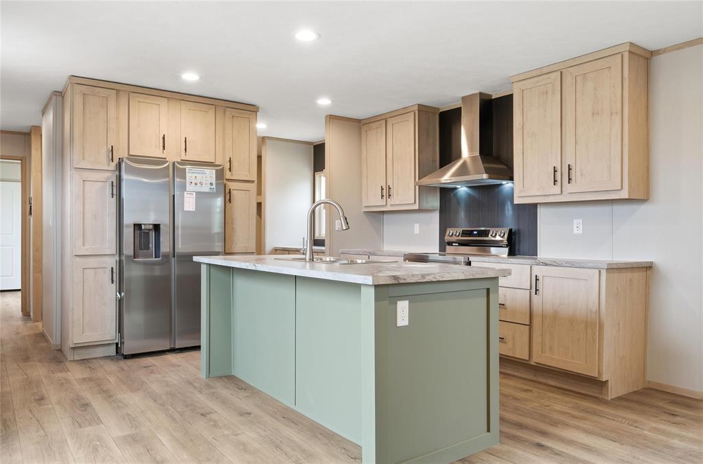 224 Derek Road Eddy, TX 76524 - Photo 3 of 24 a kitchen with kitchen island granite countertop appliances cabinets and a sink