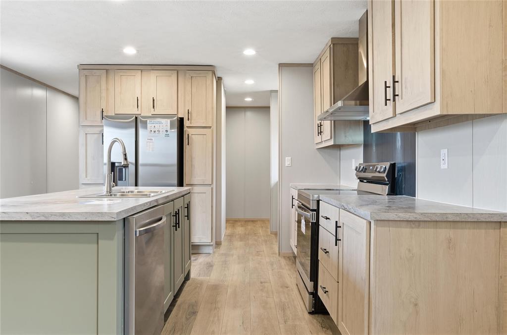 224 Derek Road Eddy, TX 76524 - Photo 4 of 24 a kitchen with stainless steel appliances granite countertop a sink and cabinets