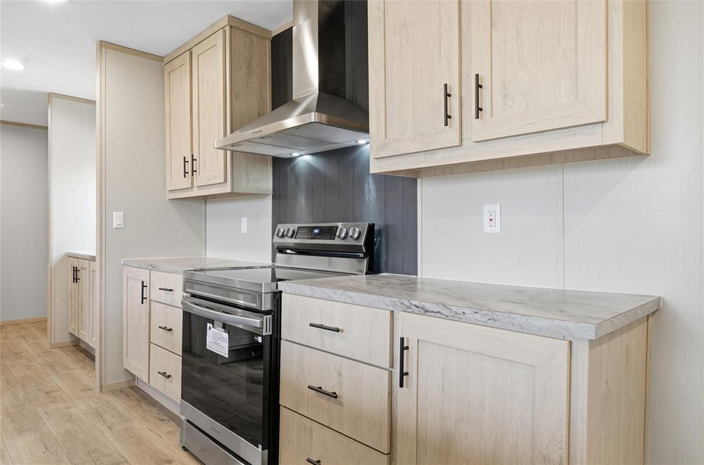 224 Derek Road Eddy, TX 76524 - Photo 5 of 24 a kitchen with stainless steel appliances granite countertop a sink and a stove