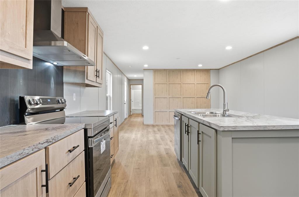 224 Derek Road Eddy, TX 76524 - Photo 6 of 24 a kitchen with a sink stove and cabinets