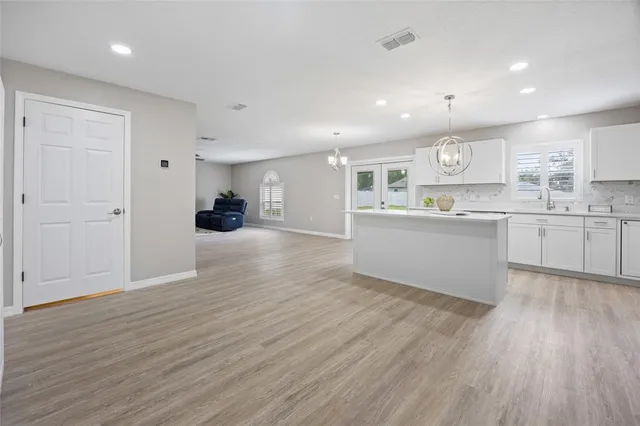 a bathroom with a sink vanity and a mirror