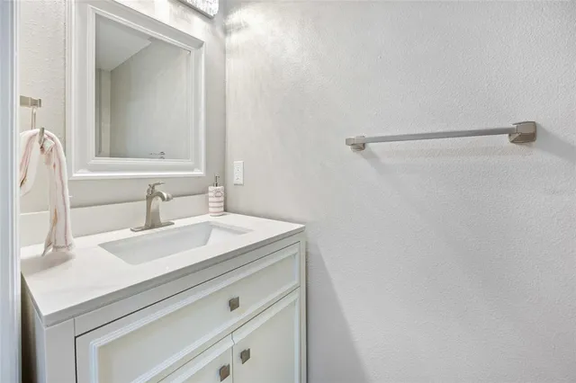 a living room with furniture and a ceiling fan