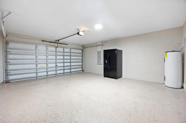 a view of a house with a big yard and large trees