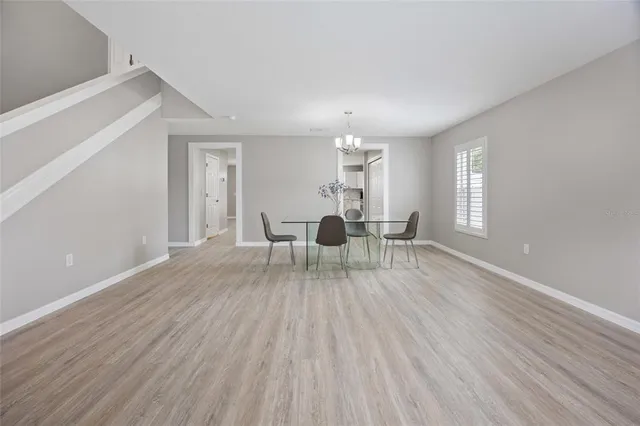 a view of dining room with furniture and wooden floor