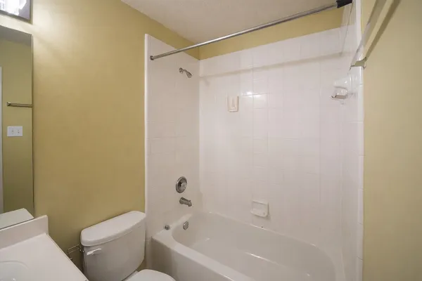 a bathroom with a toilet and a bathtub