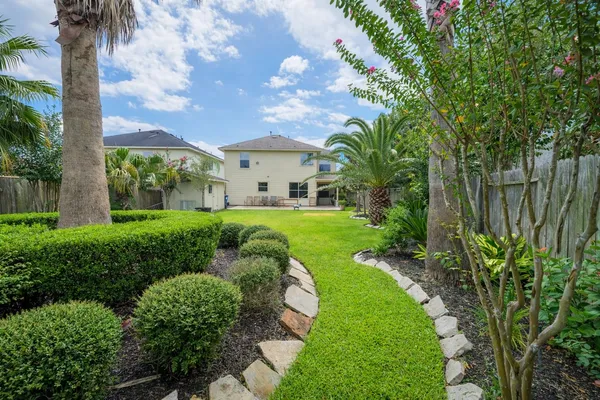 a view of a garden with a fountain