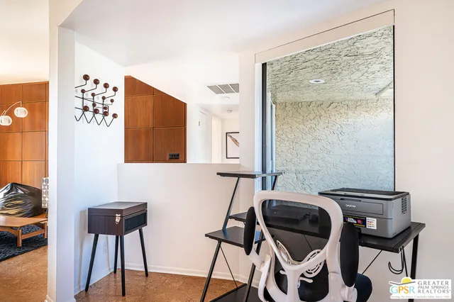 a view of a balcony and chairs