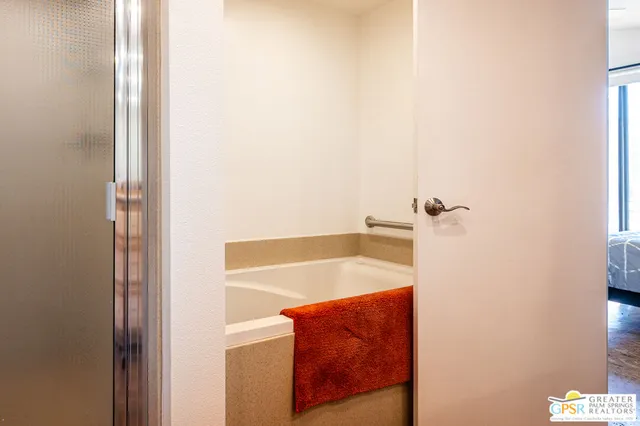 a bathroom with a tub and shower