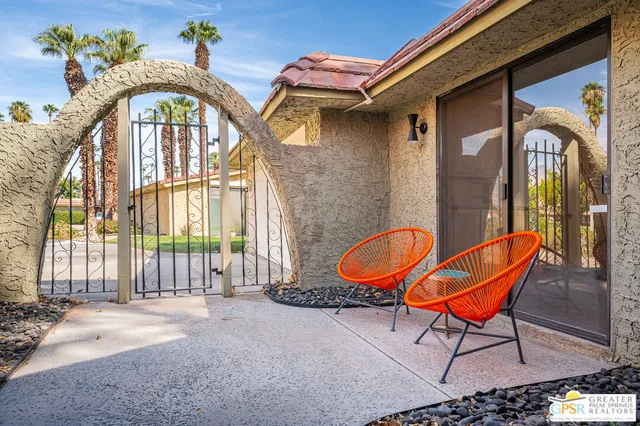 a view of a hallway with a door and stairs