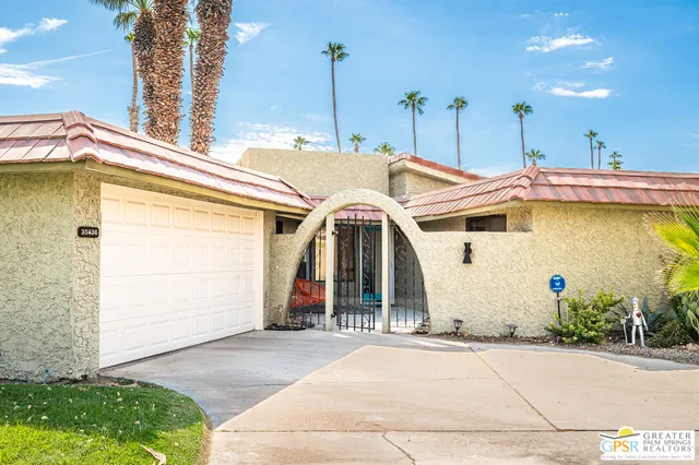 a house view with a garden space