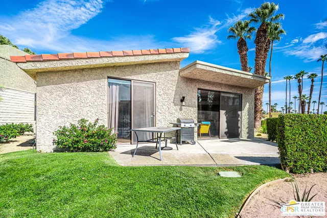 a view of a swimming pool with an outdoor seating