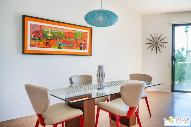 a dining room with furniture and wooden floor