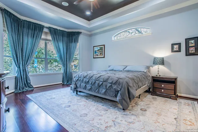 a bedroom with a bed and a table in it