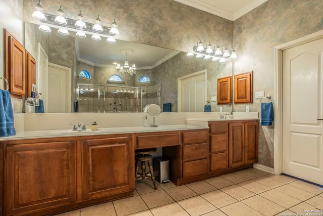 a large kitchen with a sink and cabinets