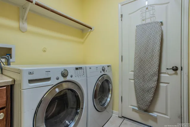 a utility room with dryer and washer