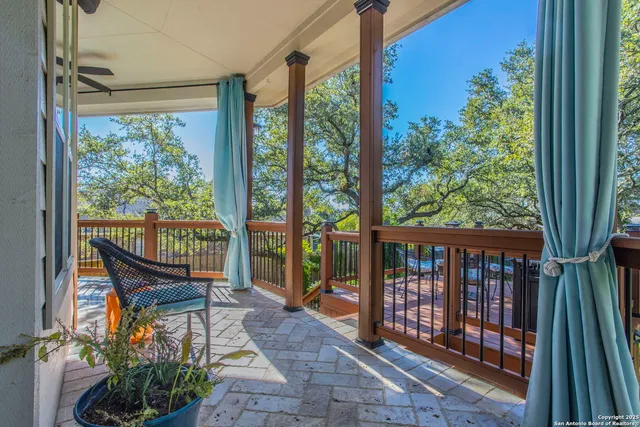 a view of a two chairs in the balcony