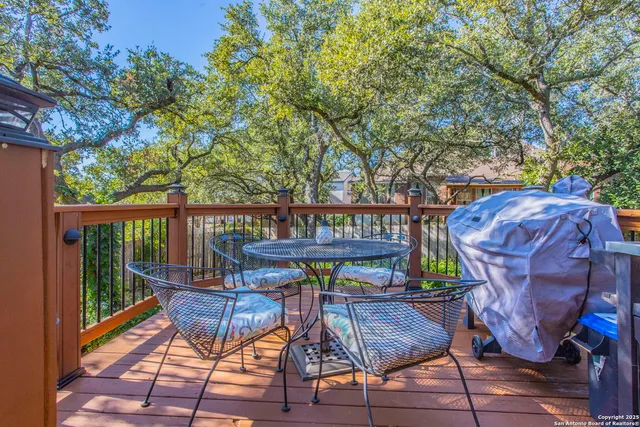 a view of balcony with wooden floor and outdoor seating