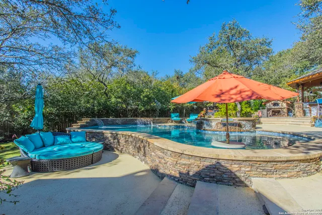 a view of a swimming pool with a patio