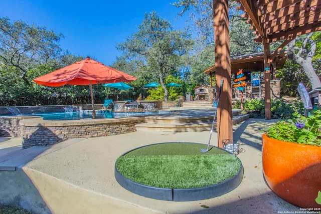 a view of a swimming pool with a patio