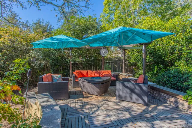 a view of outdoor sitting area with an umbrella