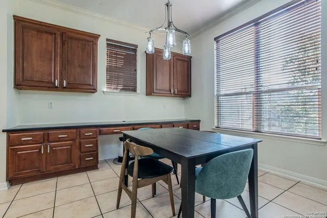a kitchen with a sink cabinets and window
