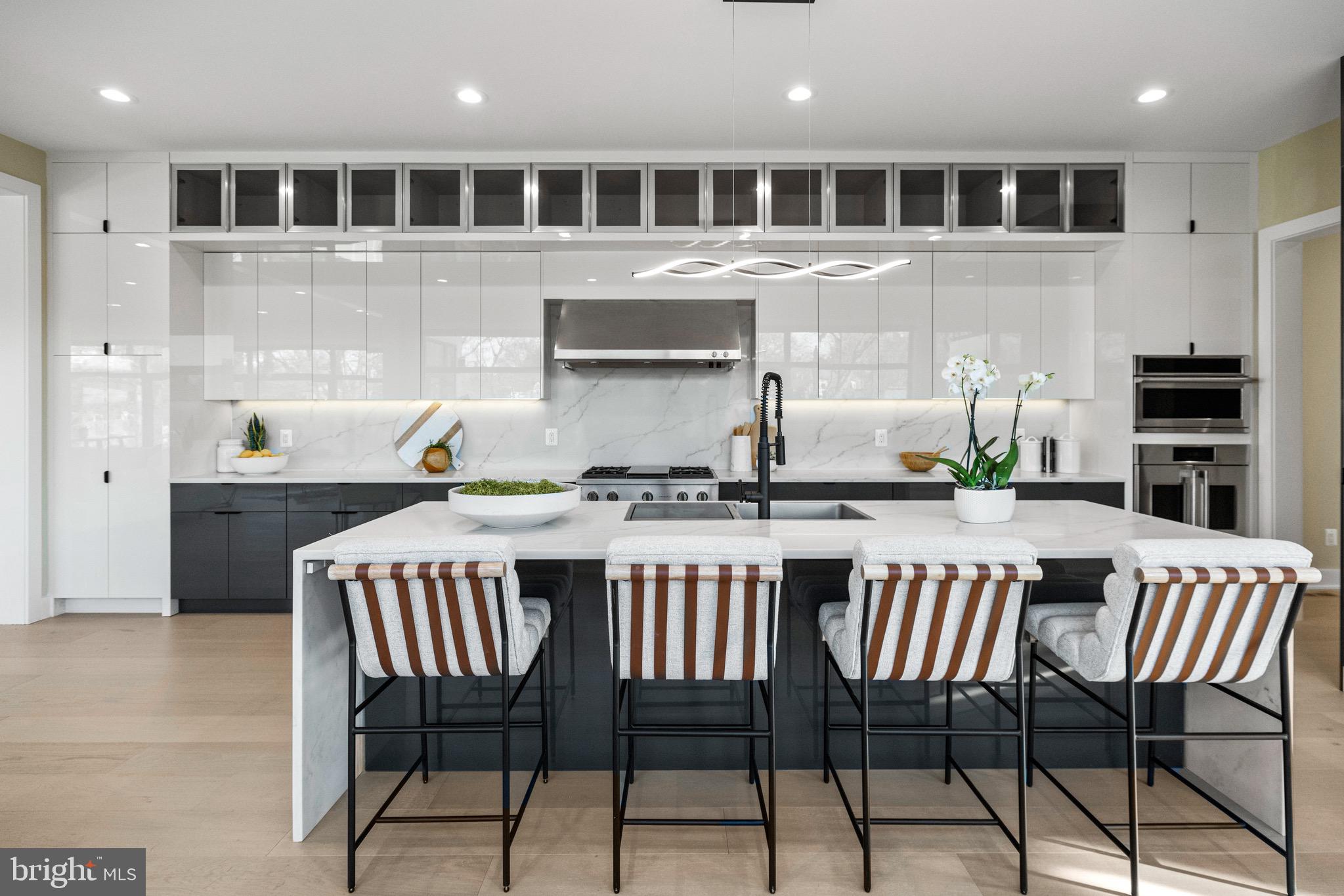 1573 Westmoreland Street McLean, VA 22101 - Photo 17 of 54 a kitchen with a table chairs stove and cabinets